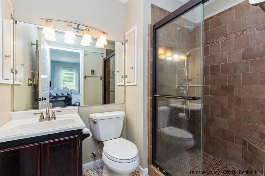 37 Michael Drive Cottekill, NY 12419 - Photo 16 of 30 a bathroom with a sink a toilet and shower