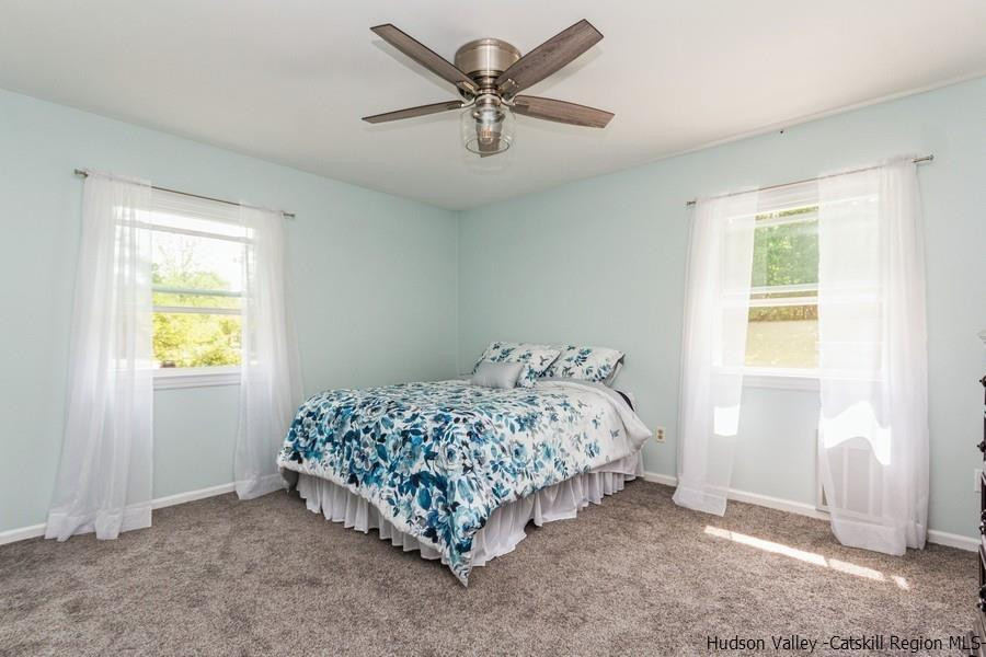 37 Michael Drive Cottekill, NY 12419 - Photo 17 of 30 a bed sitting in a bedroom next to a window