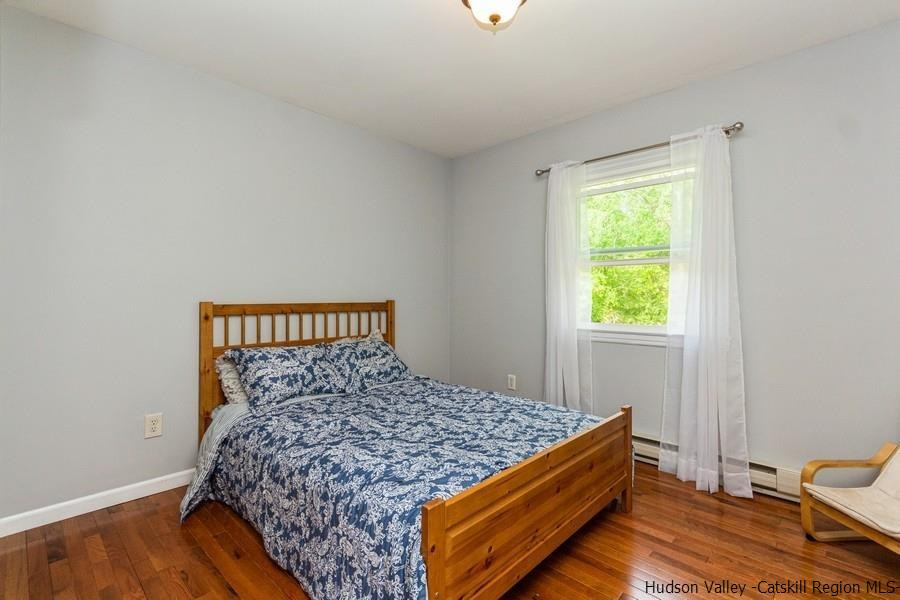 37 Michael Drive Cottekill, NY 12419 - Photo 19 of 30 a bed sitting in a bedroom next to a window
