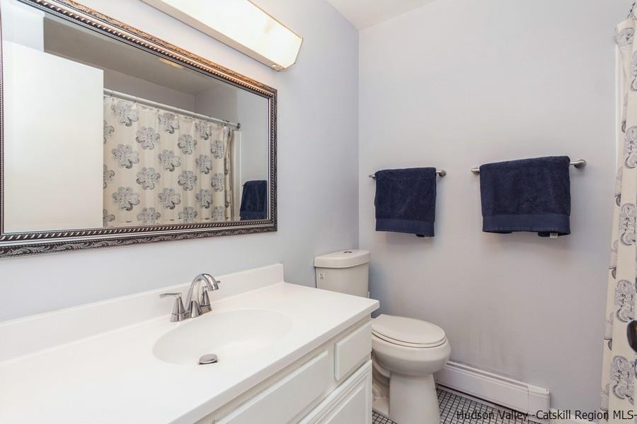 37 Michael Drive Cottekill, NY 12419 - Photo 20 of 30 a bathroom with a toilet sink and mirror