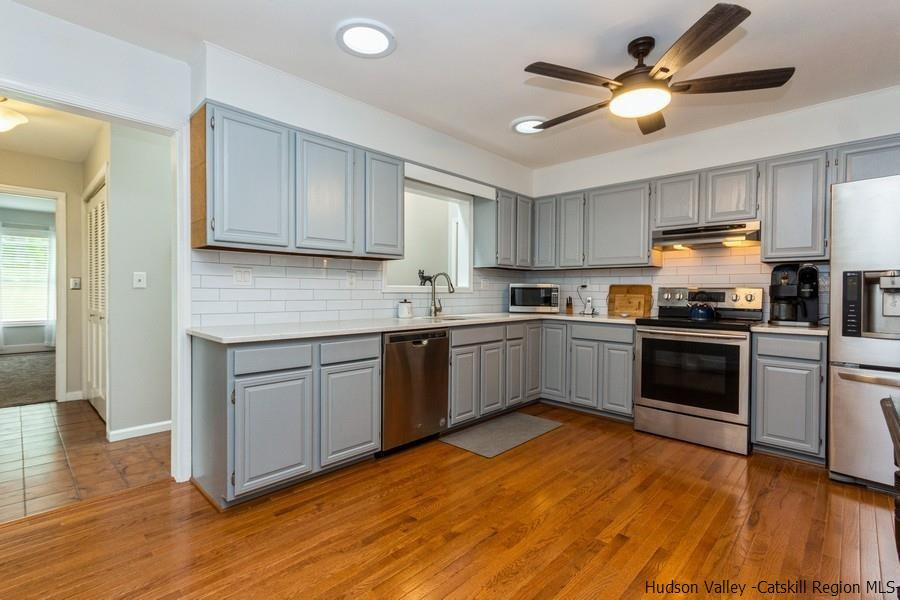 37 Michael Drive Cottekill, NY 12419 - Photo 8 of 30 a kitchen with granite countertop a sink cabinets and stainless steel appliances