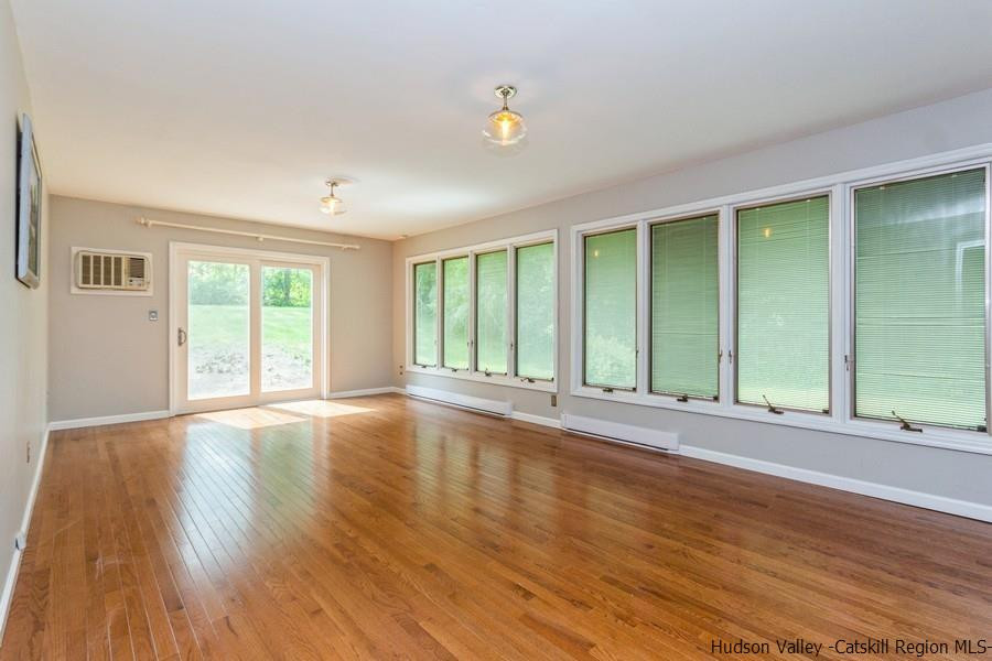 37 Michael Drive Cottekill, NY 12419 - Photo 10 of 30 a view of an empty room with wooden floor and a window