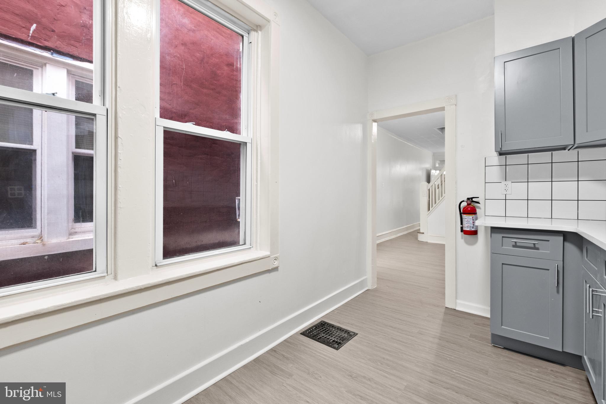 344 Middlesex Street Gloucester City, NJ 08030 - Photo 18 of 25 a view of a kitchen with wooden floor and cabinet