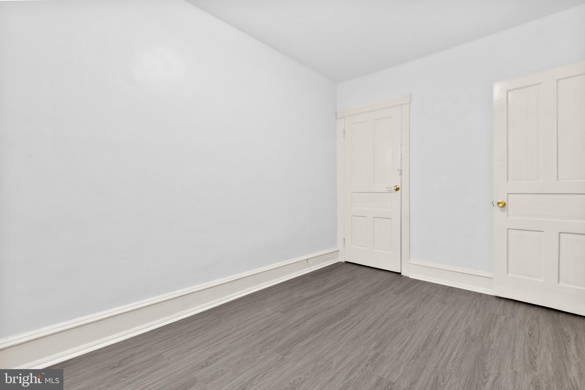 344 Middlesex Street Gloucester City, NJ 08030 - Photo 24 of 25 a view of an empty room with wooden floor