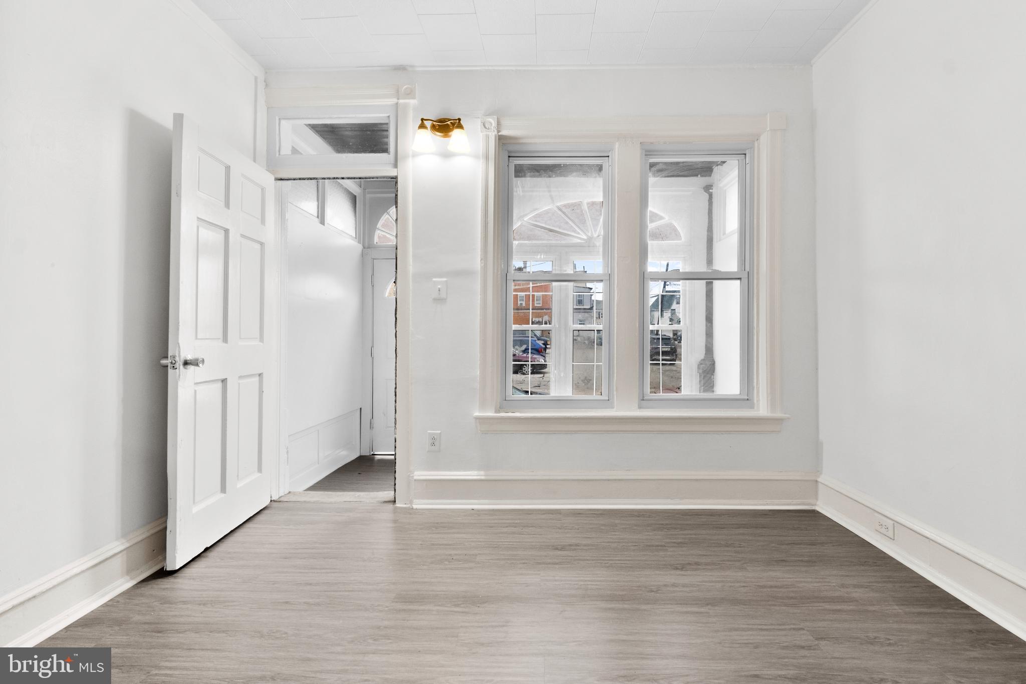 344 Middlesex Street Gloucester City, NJ 08030 - Photo 6 of 25 a view of empty room with wooden floor and fan
