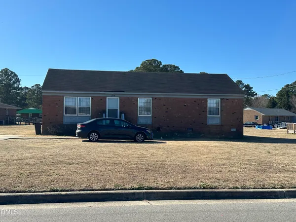 a front view of a house with yard