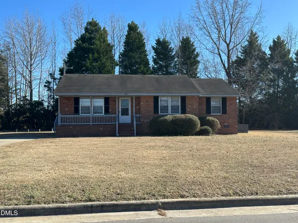 a house with trees in the background