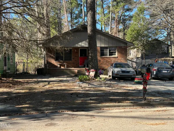 a view of a parked cars in front of a house