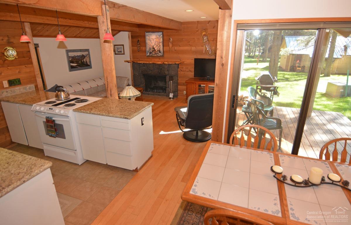 57515 Ranch Cabin Road, Unit B15 Sunriver, OR 97707 - Photo 13 of 21 Dining area overlooks deck and grounds.