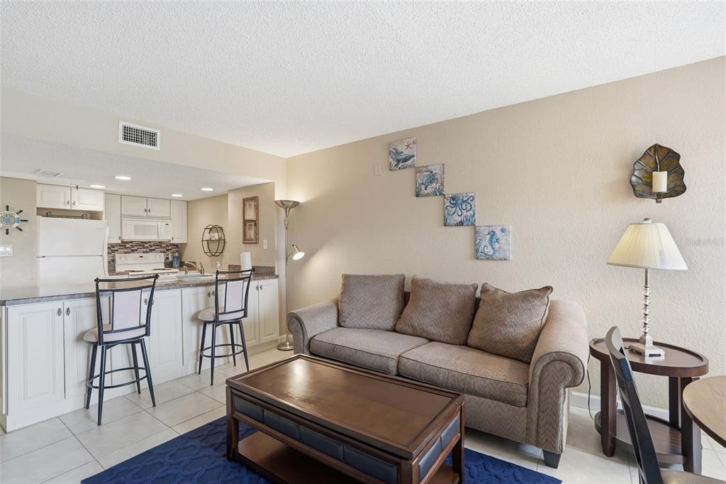 3170 Matecumbe Key Road, Unit 127 Punta Gorda, FL 33955 - Photo 8 of 22 a living room with furniture and a wooden floor