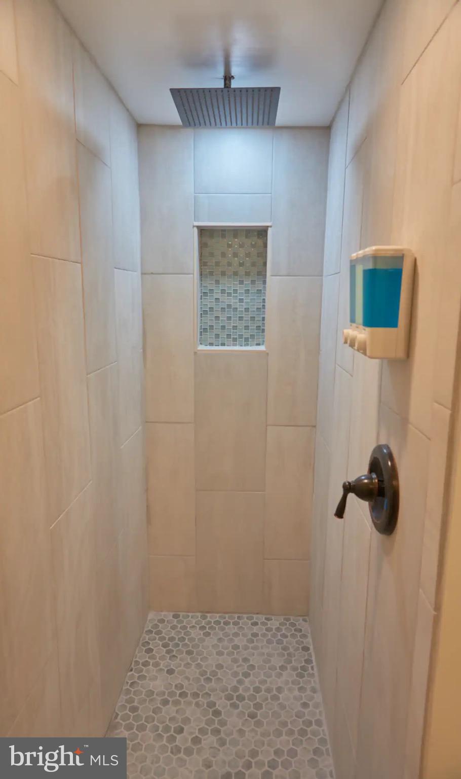 13907 Sand Dune Road, Unit 2A Ocean City, MD 21842 - Photo 17 of 27 Primary bath walk in shower with custom tile