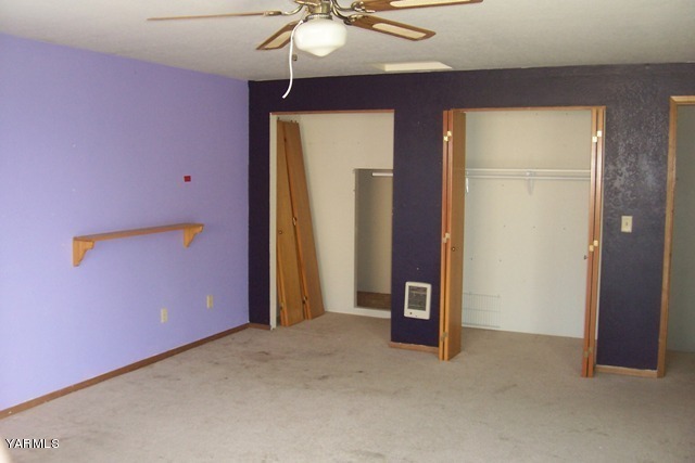 2660 Jones Road Wapato, WA 98951 - Photo 8 of 13 an empty room with chandelier fan