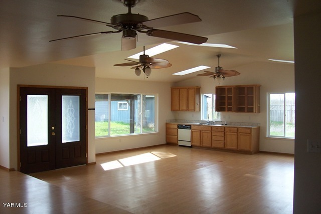 2660 Jones Road Wapato, WA 98951 - Photo 9 of 13 a view of a kitchen with a stove wooden floor and a kitchen view