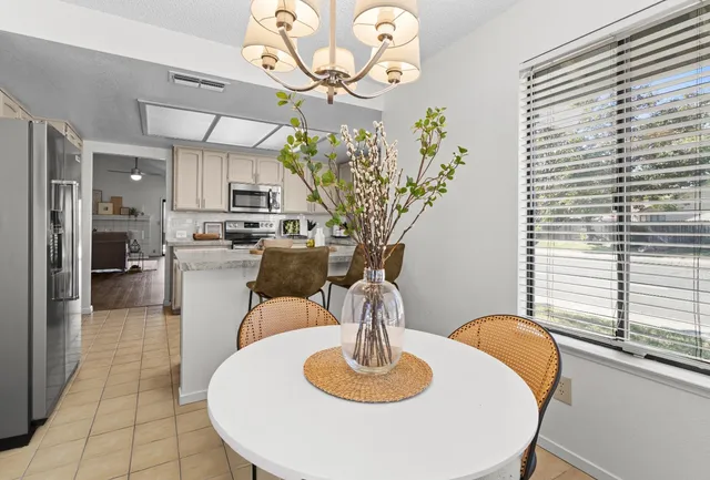 a living room with furniture and a table