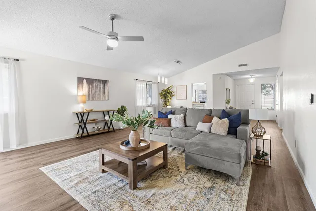 a living room with furniture and a fireplace
