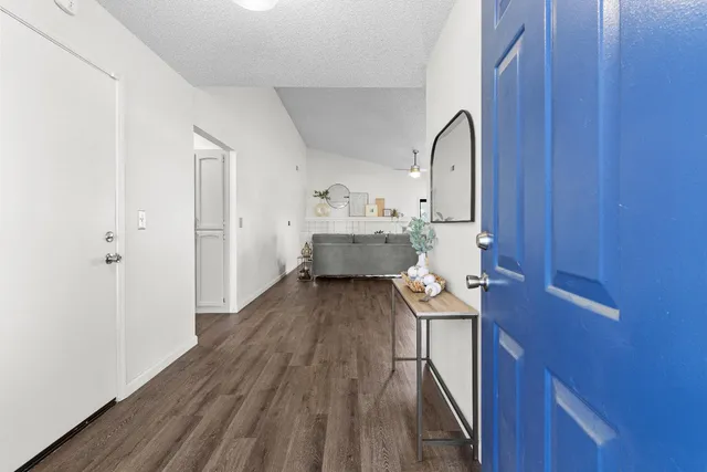 a view of entryway with wooden floor