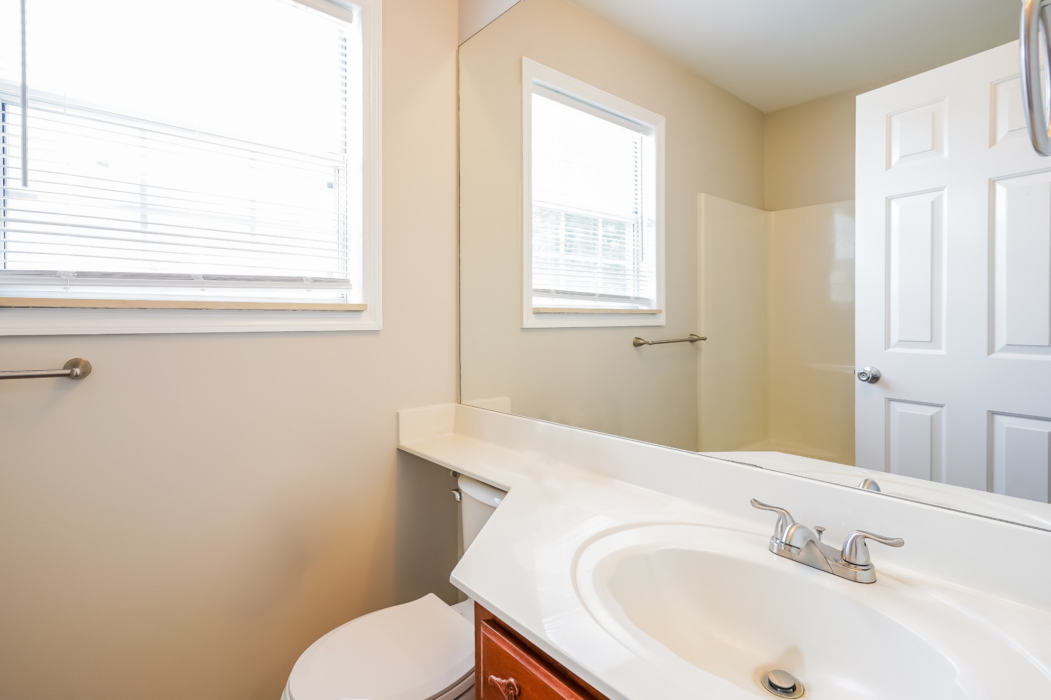 1204 Curran Court Antioch, TN 37013 - Photo 14 of 16 a bathroom with a sink a toilet and a window
