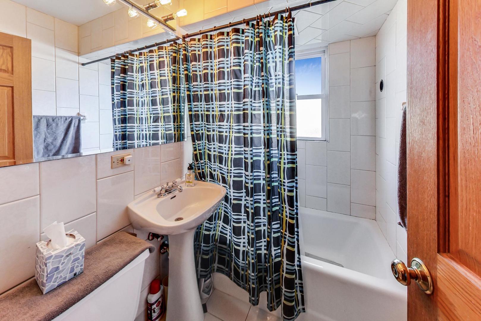 3616 West 116th Street Chicago, IL 60655 - Photo 11 of 33 a bathroom with a sink toilet and shower