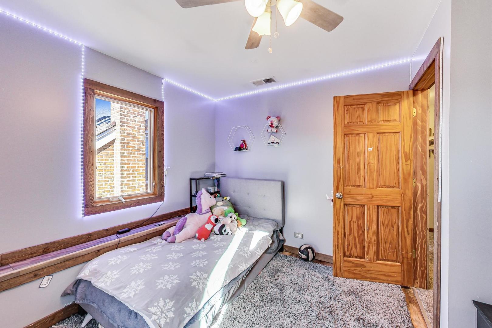 3616 West 116th Street Chicago, IL 60655 - Photo 16 of 33 a bed room with a bed and a window
