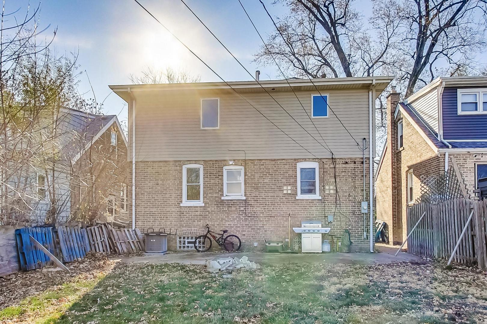 3616 West 116th Street Chicago, IL 60655 - Photo 26 of 33 a front view of a house with patio