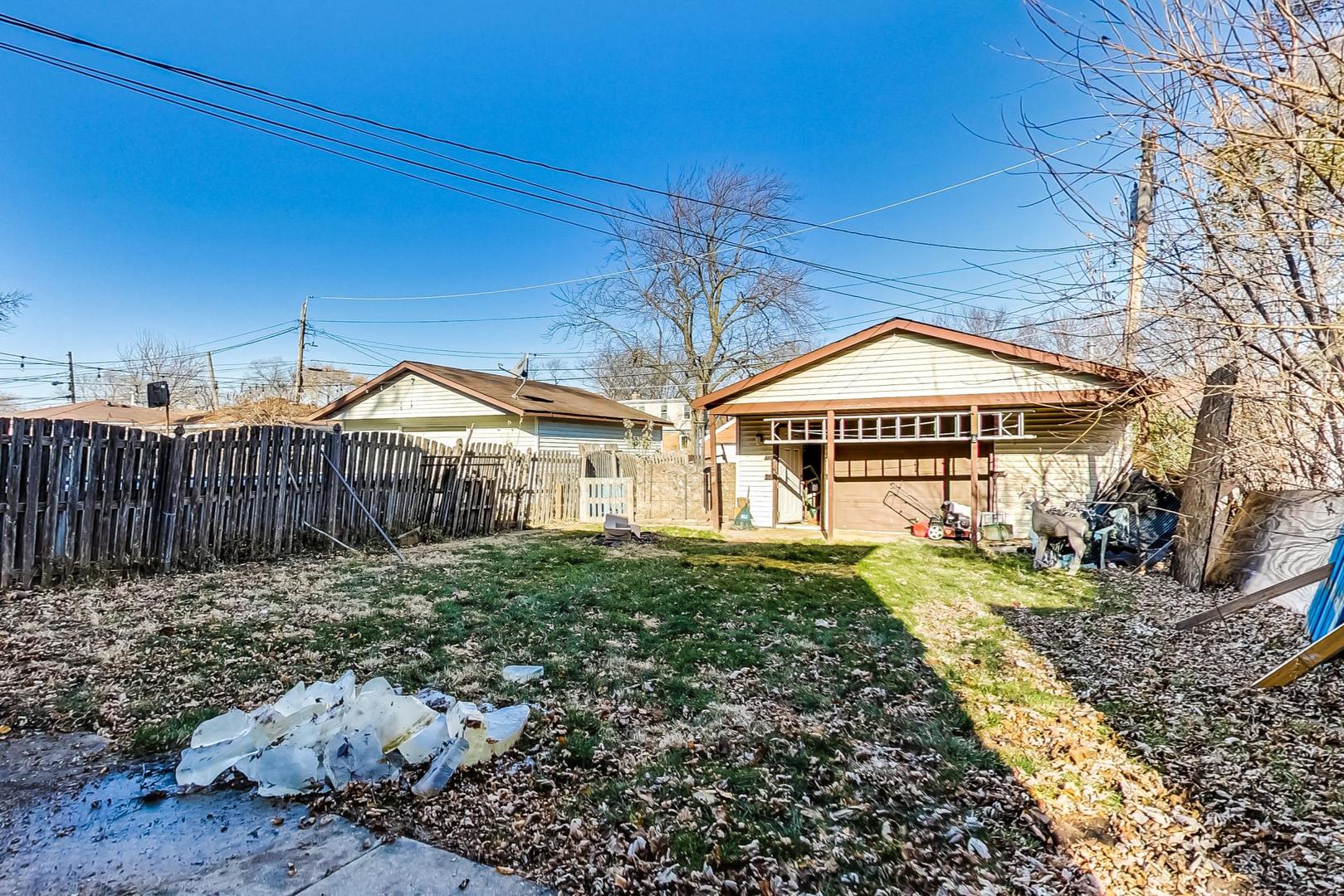 3616 West 116th Street Chicago, IL 60655 - Photo 29 of 33 a front view of a house with a yard