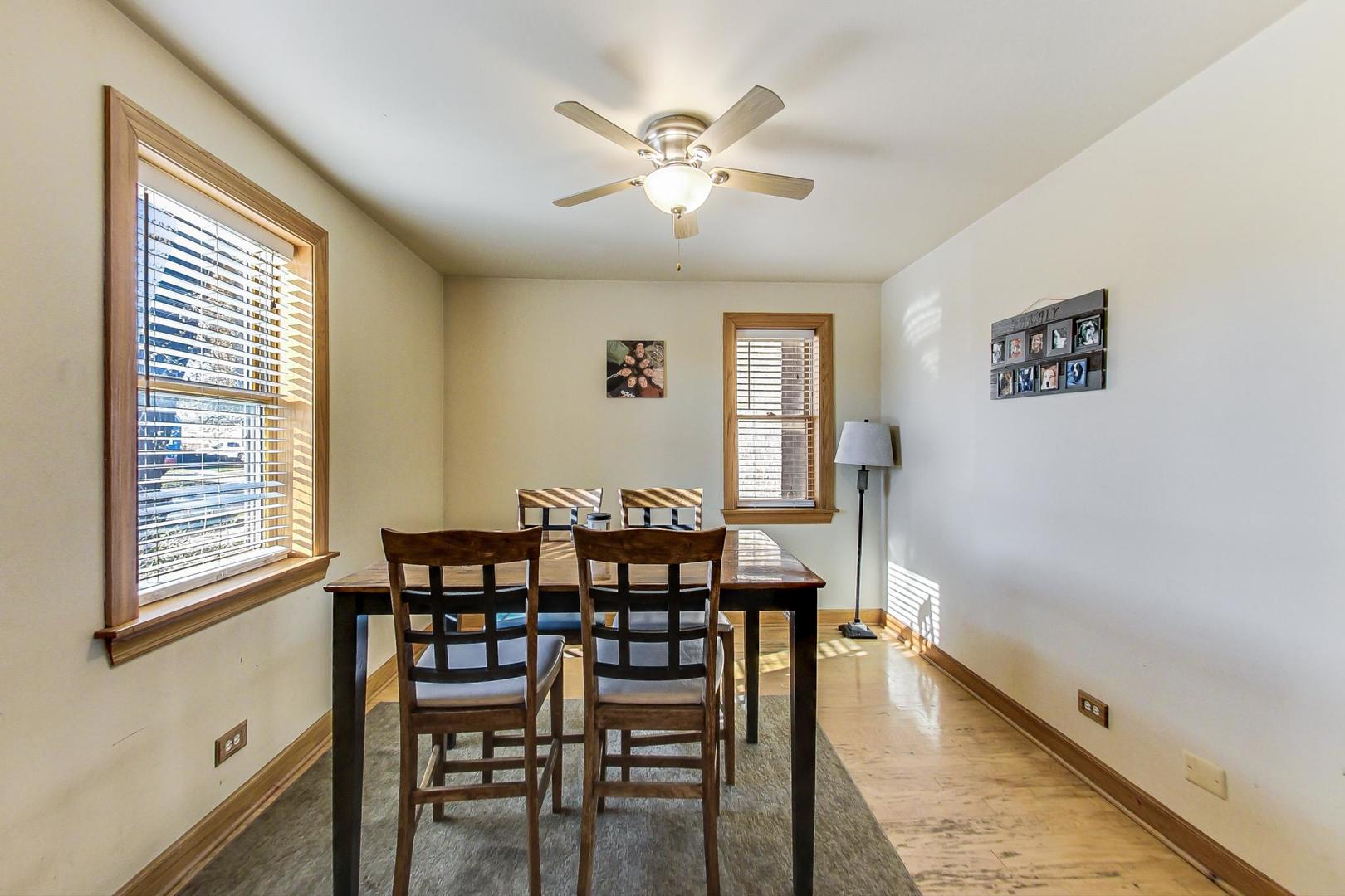 3616 West 116th Street Chicago, IL 60655 - Photo 4 of 33 a view of a dining room with furniture and wooden floor