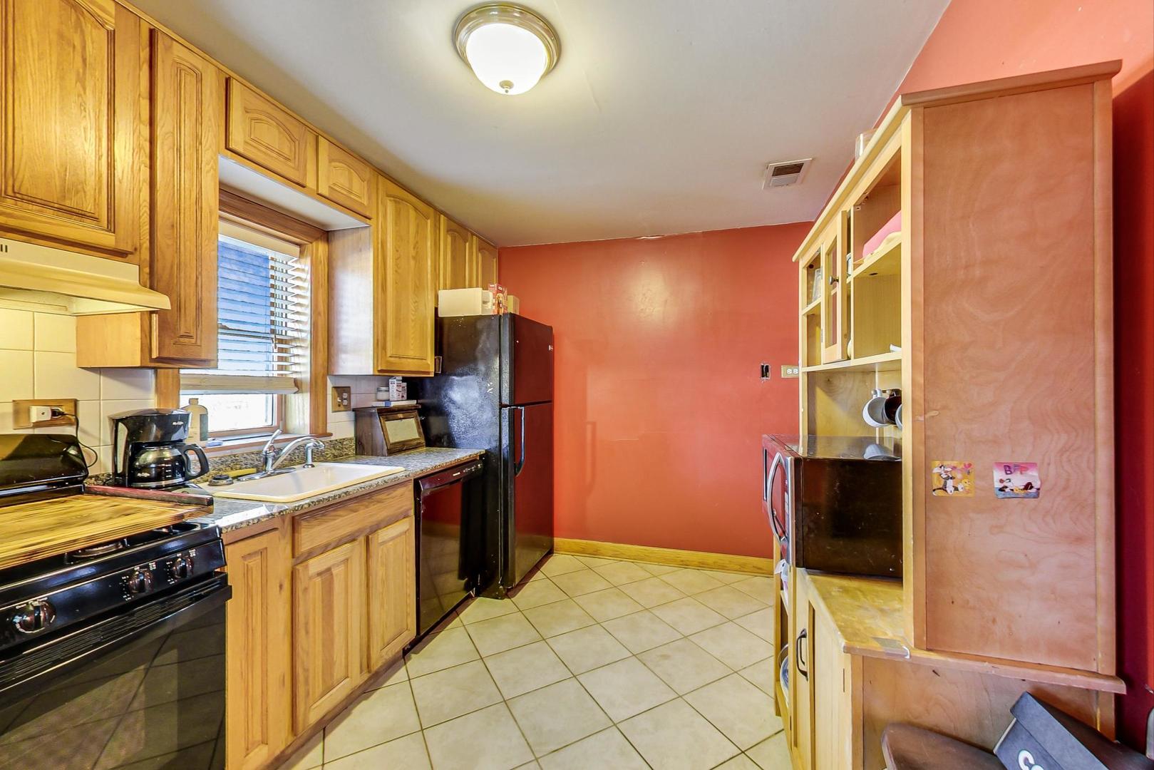 3616 West 116th Street Chicago, IL 60655 - Photo 6 of 33 a kitchen with a sink stove and refrigerator