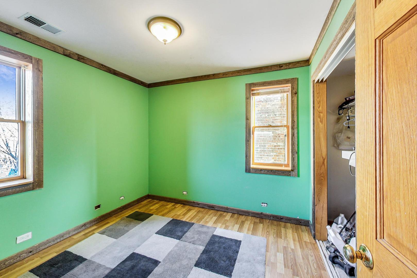 3616 West 116th Street Chicago, IL 60655 - Photo 9 of 33 a room with window and a wooden floor