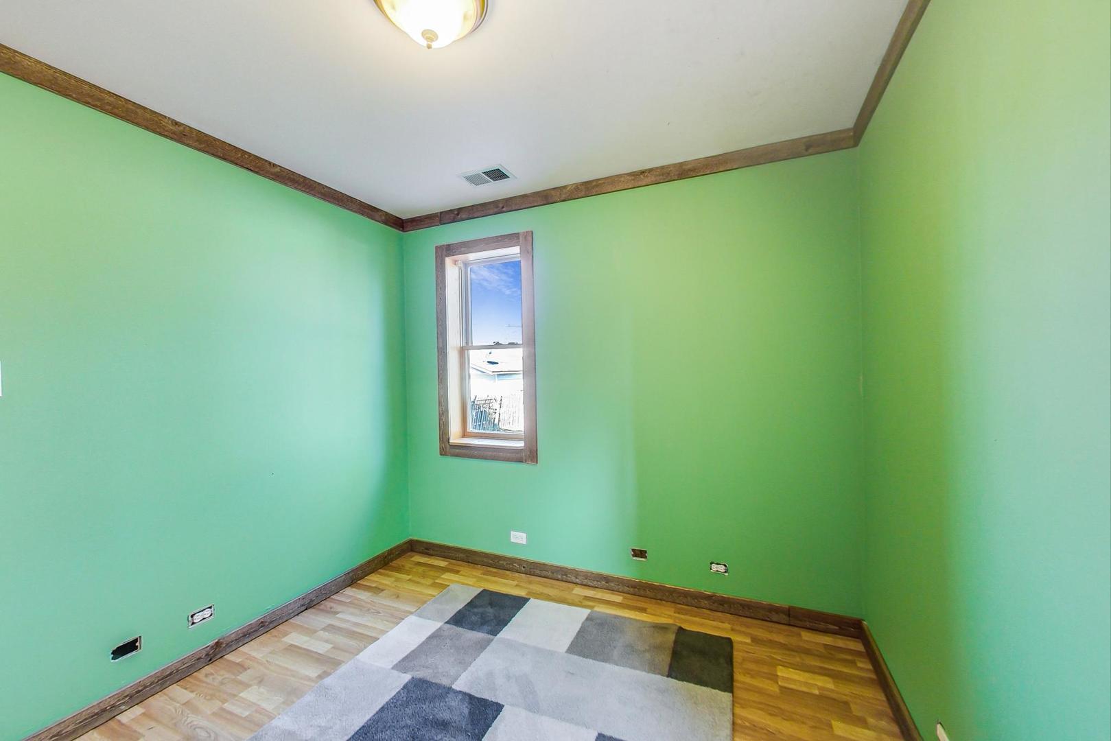 3616 West 116th Street Chicago, IL 60655 - Photo 10 of 33 a room with a window and a ceiling fan