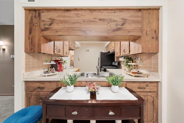 a kitchen with a sink and cabinets