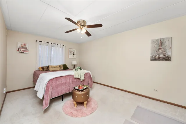 a bed room with a bed and a chandelier