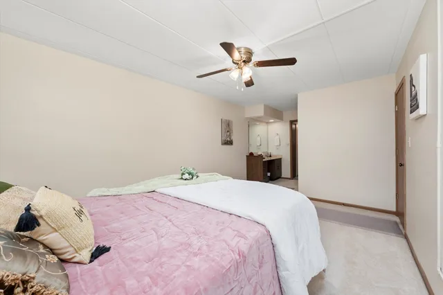 a bedroom with a bed and cabinets