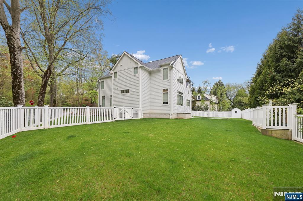 31 Engleside Street Cresskill, NJ 07626 - Photo 42 of 49 a view of a house with backyard and fence