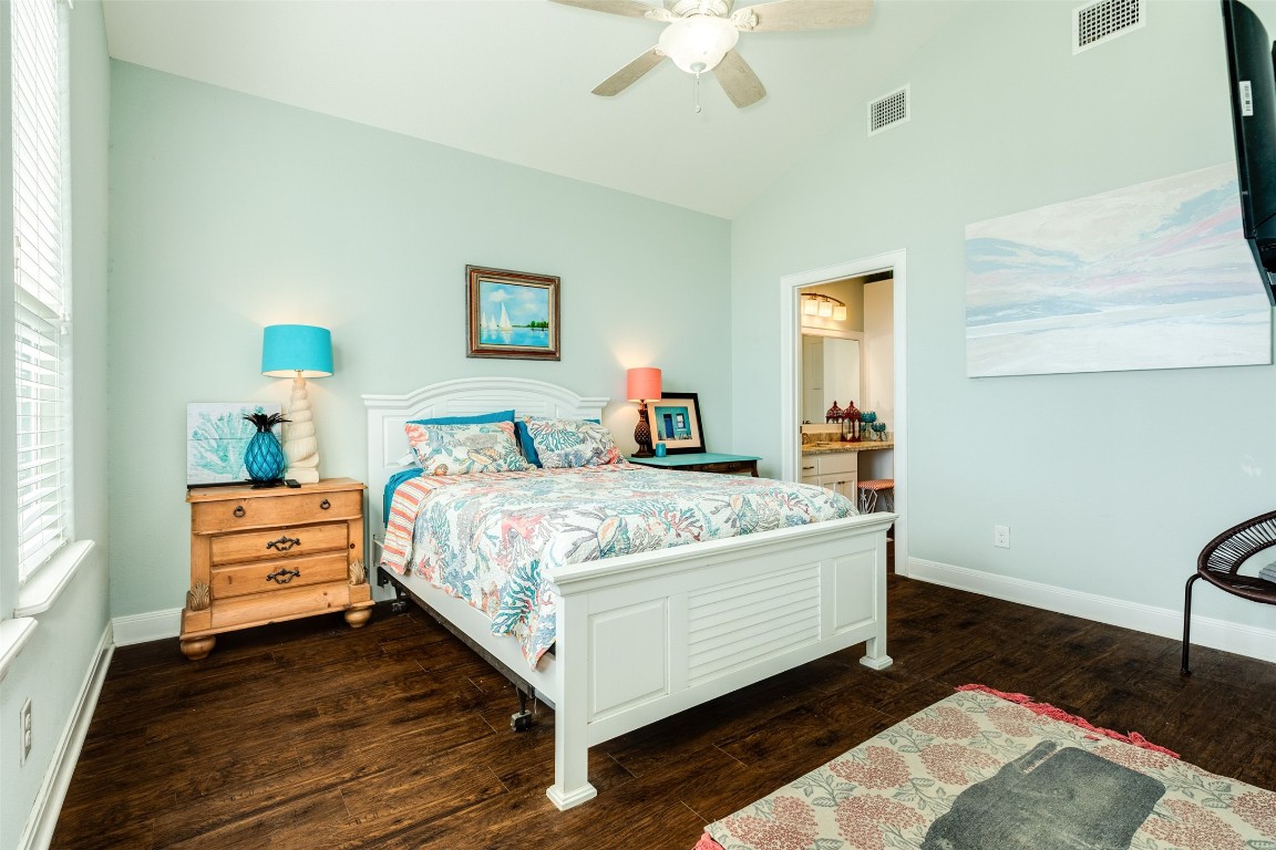 510 Point Lookout Surfside Beach, TX 77541 - Photo 14 of 41 a bedroom with a bed and wooden floor