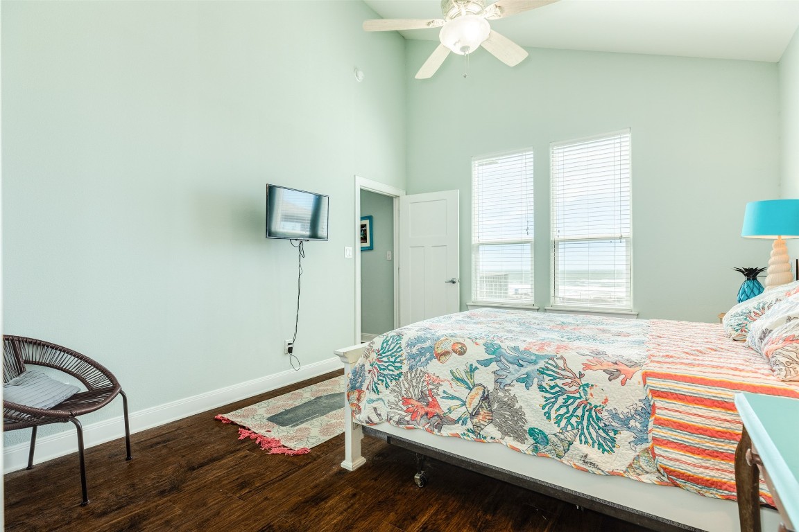 510 Point Lookout Surfside Beach, TX 77541 - Photo 15 of 41 a bedroom with bed and wooden floor