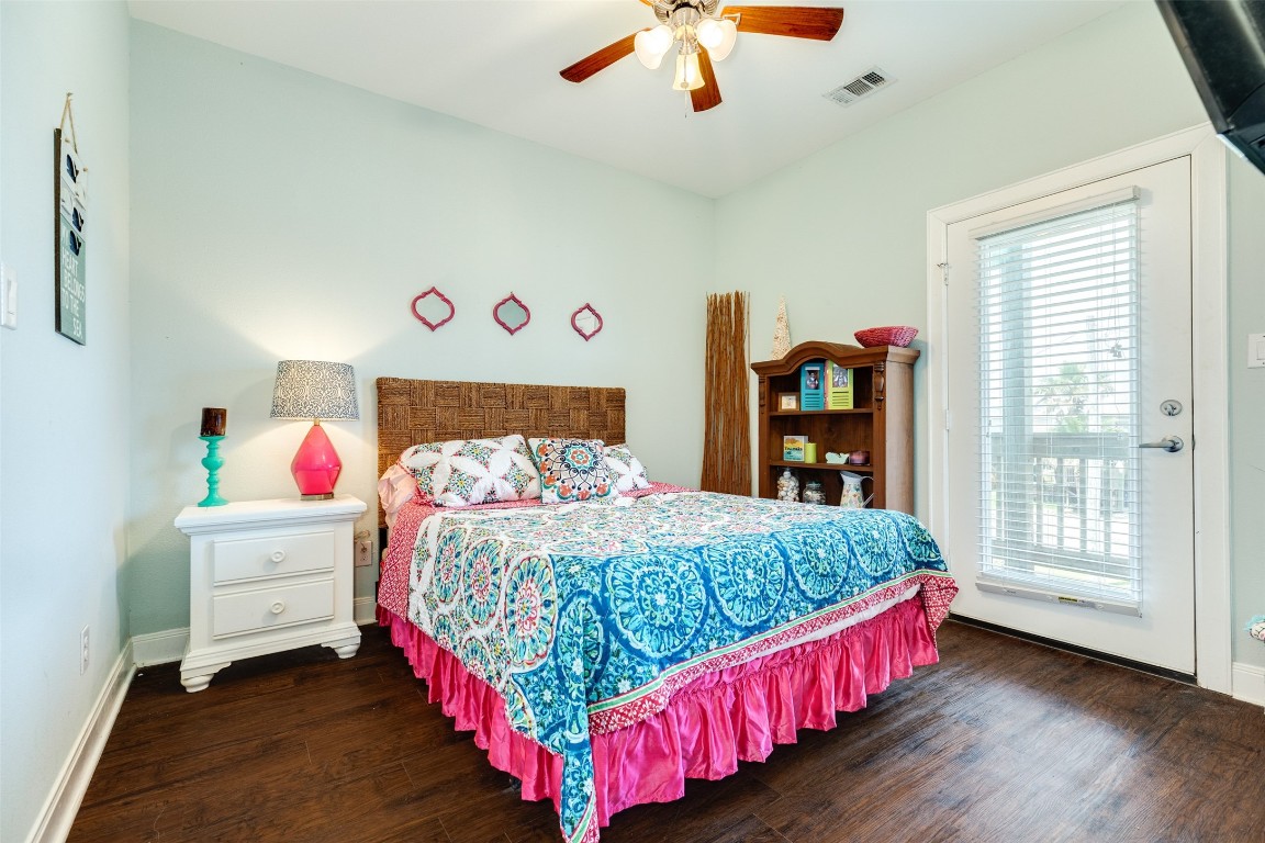 510 Point Lookout Surfside Beach, TX 77541 - Photo 18 of 41 a bedroom with a bed and a large window