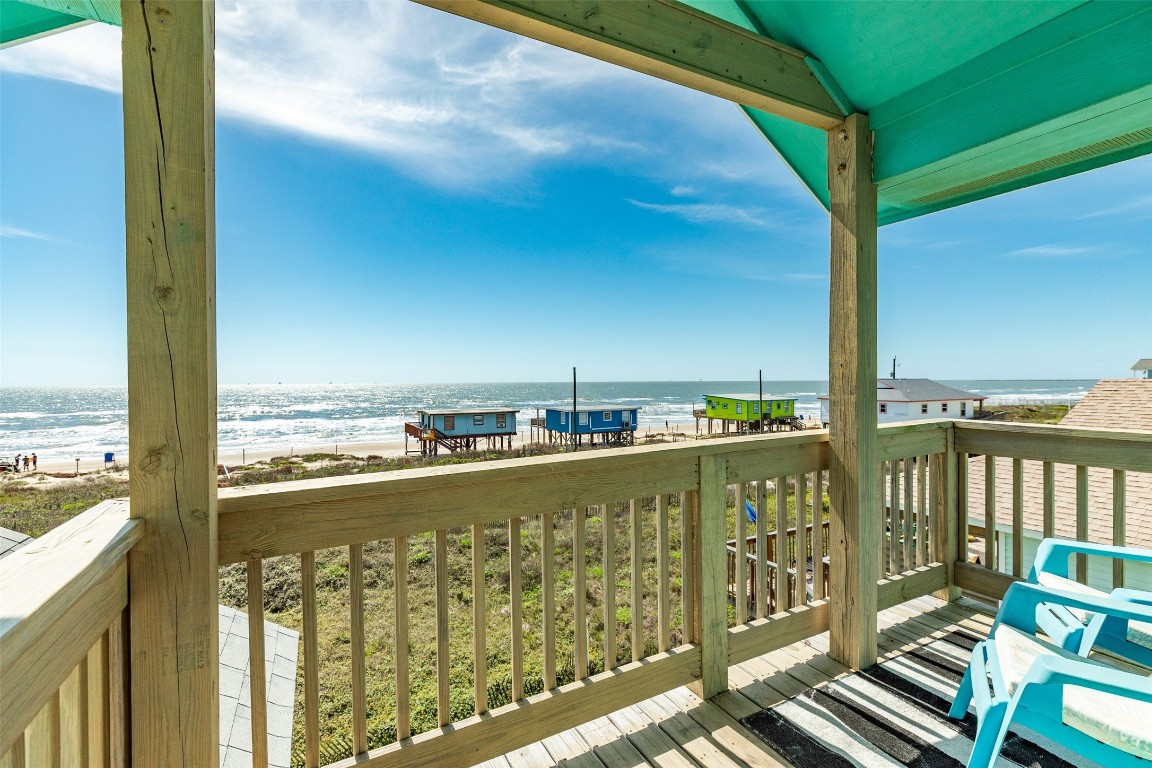 510 Point Lookout Surfside Beach, TX 77541 - Photo 4 of 41 a view of a balcony with wooden floor next to a building