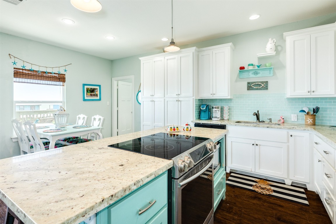 510 Point Lookout Surfside Beach, TX 77541 - Photo 9 of 41 a kitchen with a sink stove and cabinets