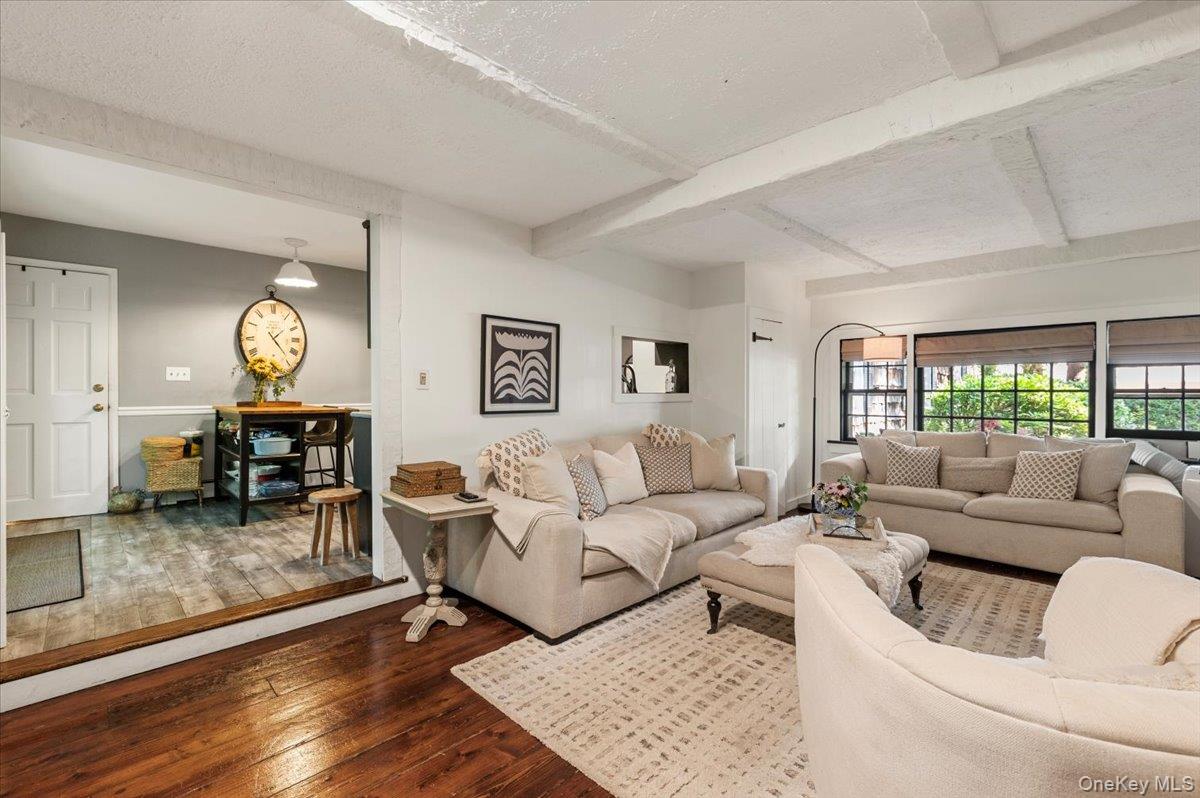 10 Rancher Place Huntington, NY 11743 - Photo 16 of 44 Living room with exposed ceiling beams and dark wood-finish flooring