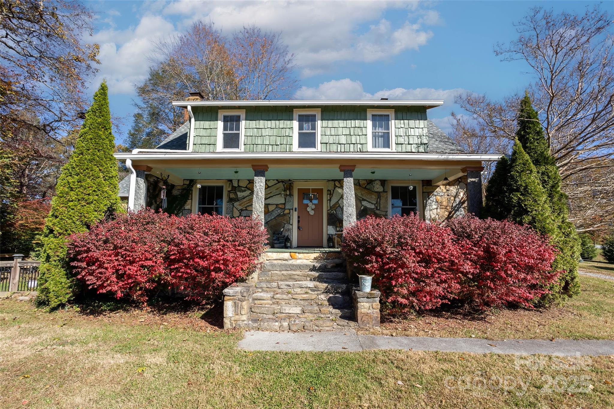 front view of a house with a yard