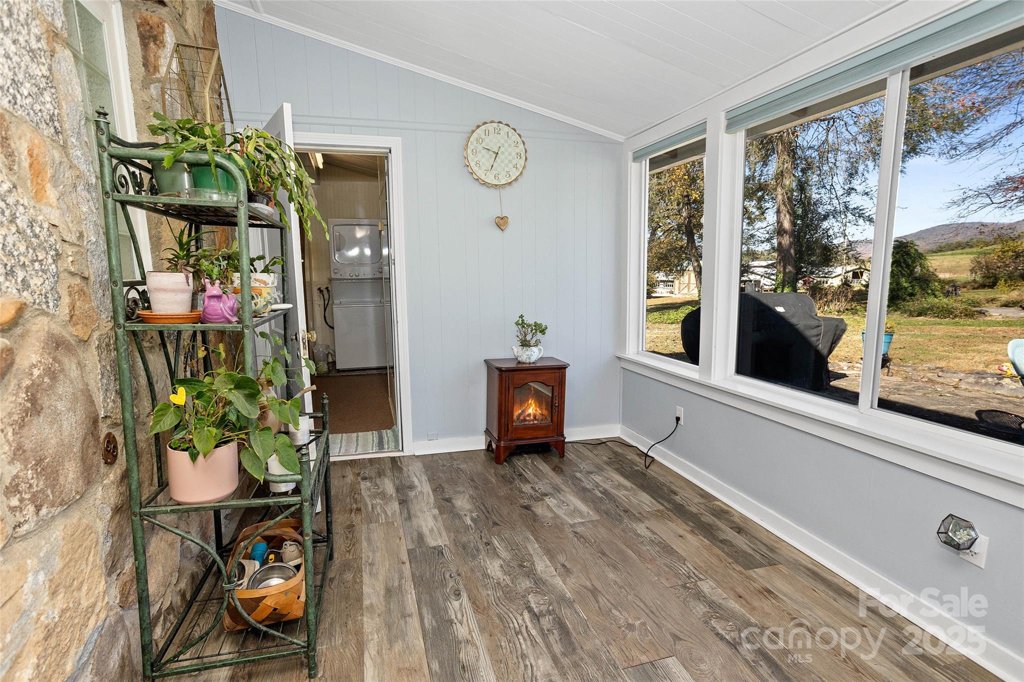 3471 Chimney Rock Road Hendersonville, NC 28792 - Photo 14 of 48 a living room with furniture and a potted plant
