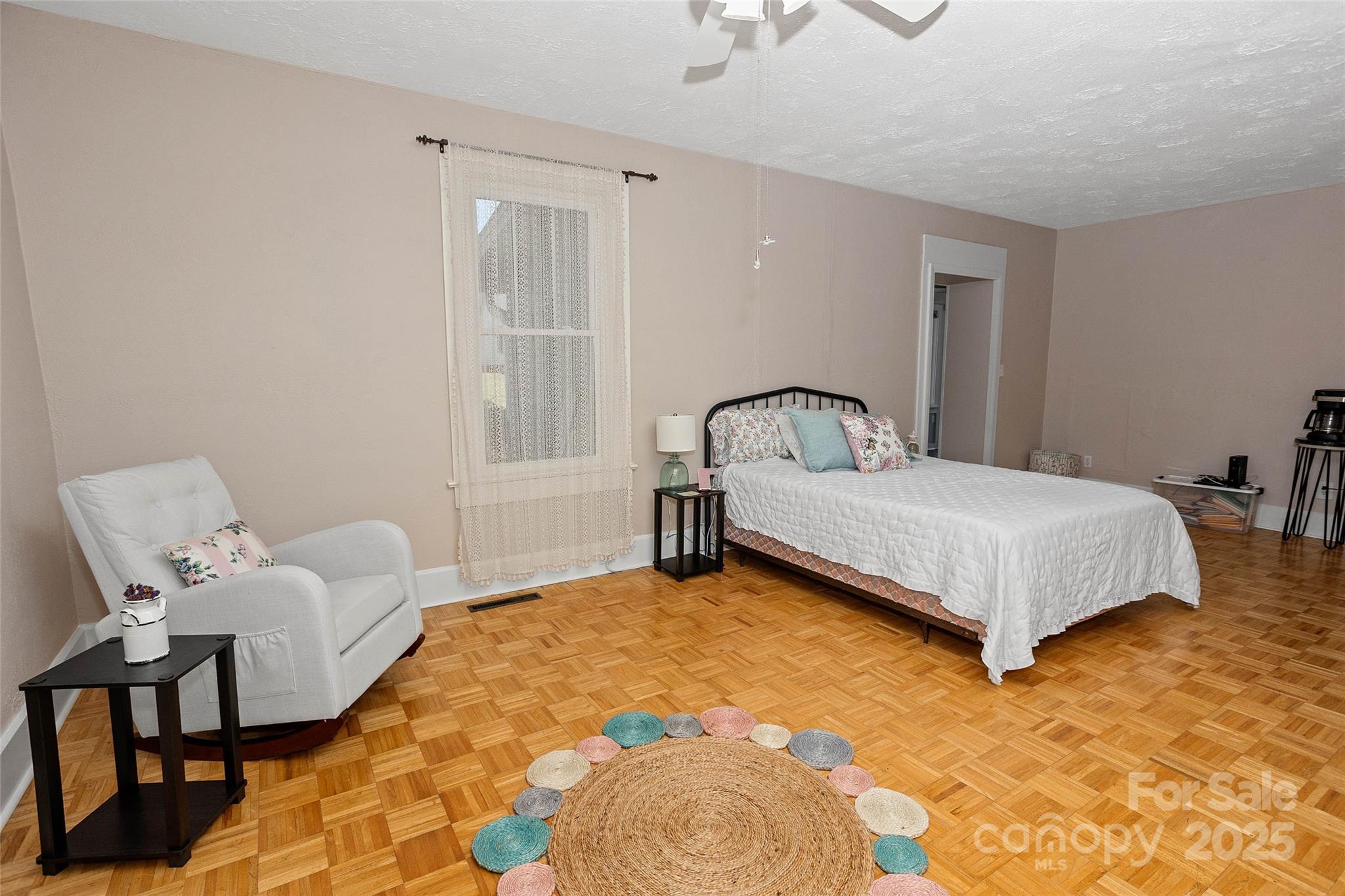 3471 Chimney Rock Road Hendersonville, NC 28792 - Photo 16 of 48 a bedroom with a bed chair and a window