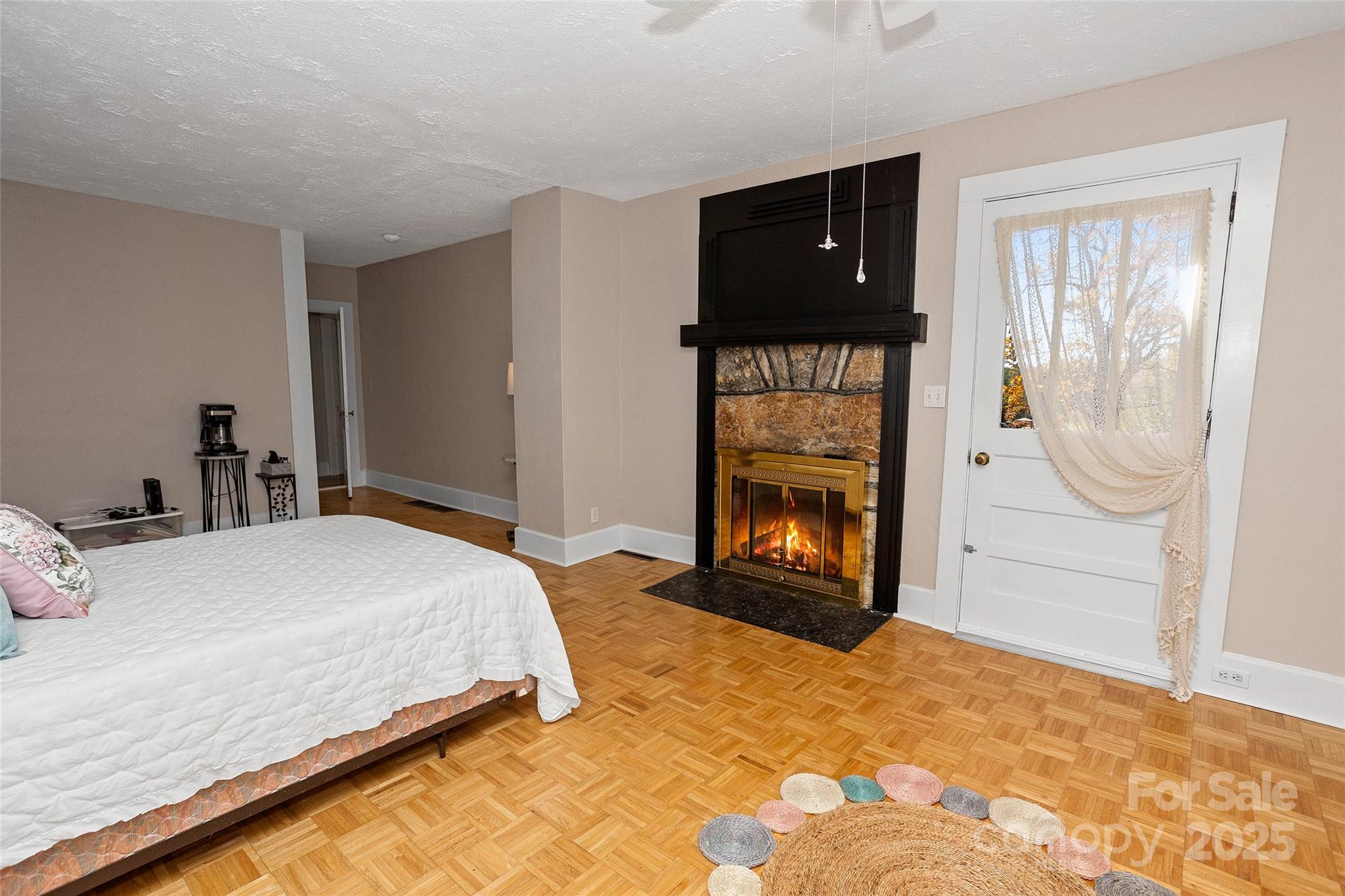 3471 Chimney Rock Road Hendersonville, NC 28792 - Photo 17 of 48 a bedroom with a bed and a fireplace