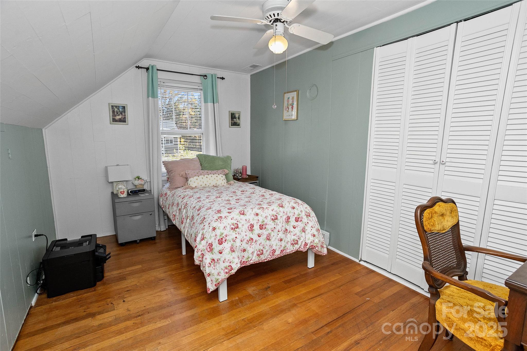 3471 Chimney Rock Road Hendersonville, NC 28792 - Photo 19 of 48 a bedroom with a bed and wooden floor