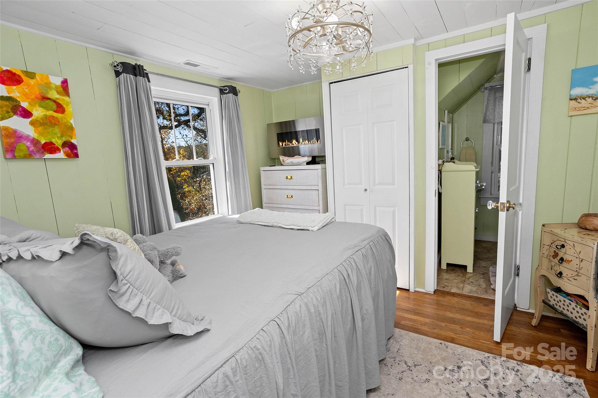 3471 Chimney Rock Road Hendersonville, NC 28792 - Photo 28 of 48 a bedroom with a bed and a window