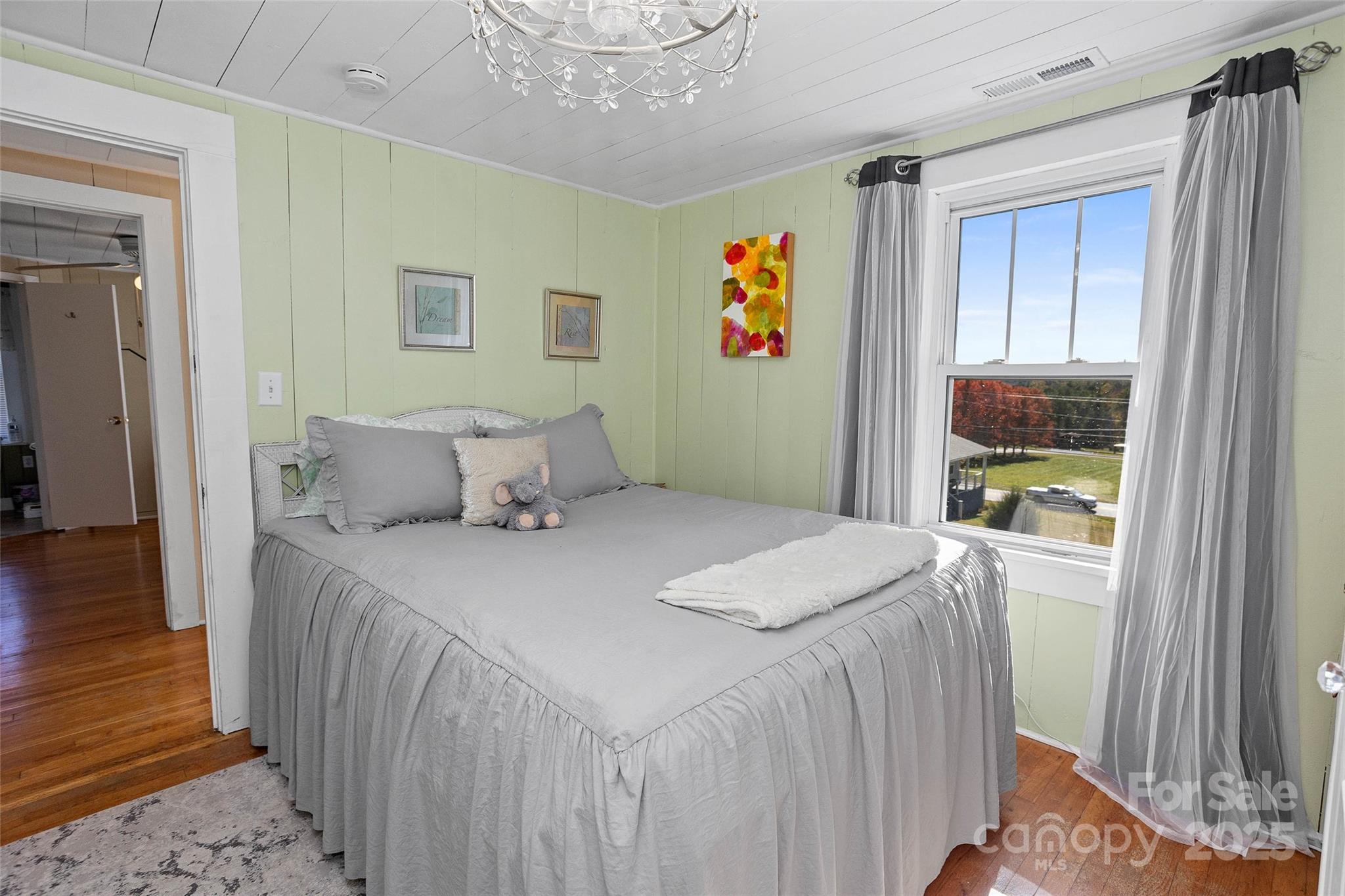 3471 Chimney Rock Road Hendersonville, NC 28792 - Photo 29 of 48 a bedroom with a bed and a window