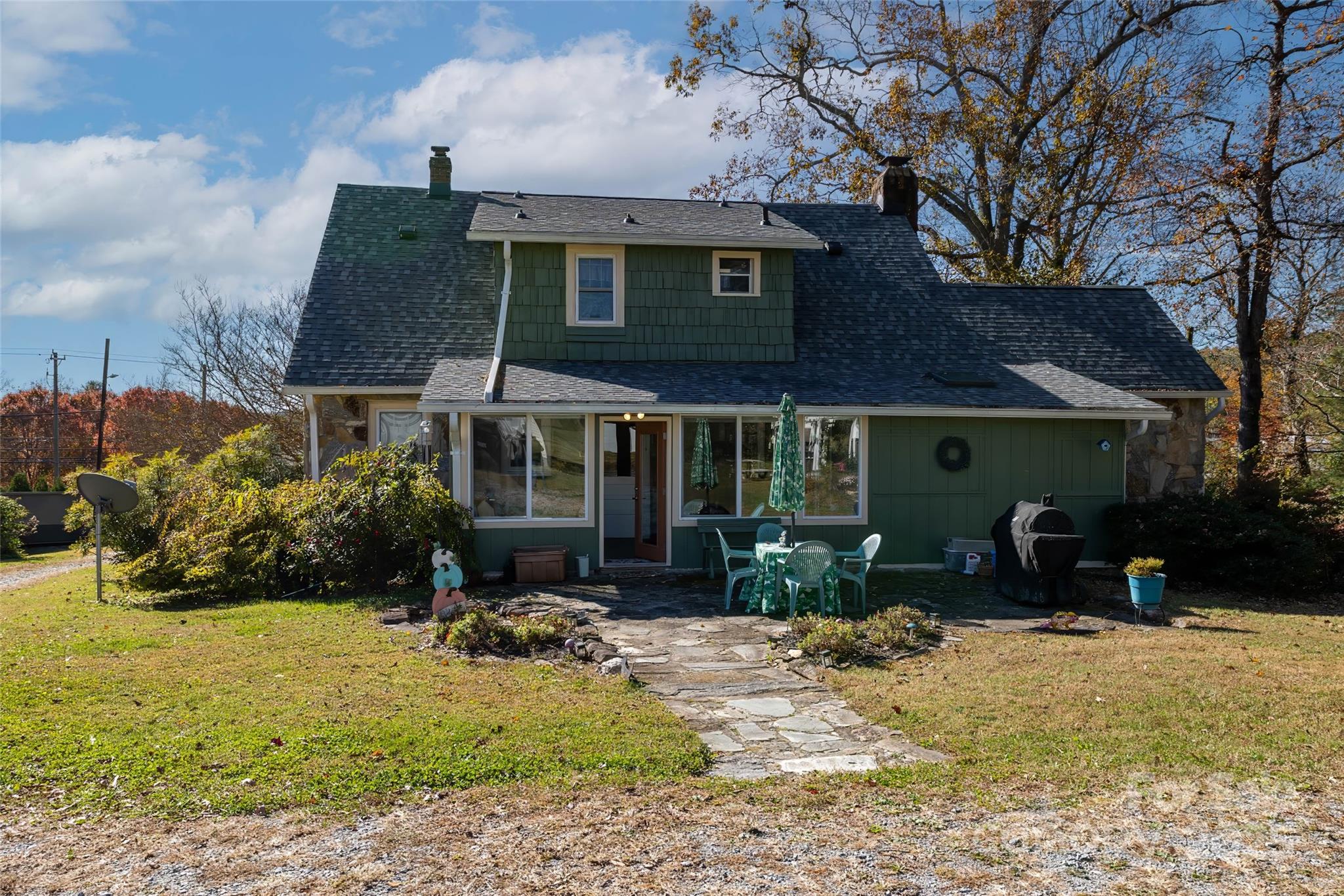 3471 Chimney Rock Road Hendersonville, NC 28792 - Photo 3 of 48 a front view of a house with a yard