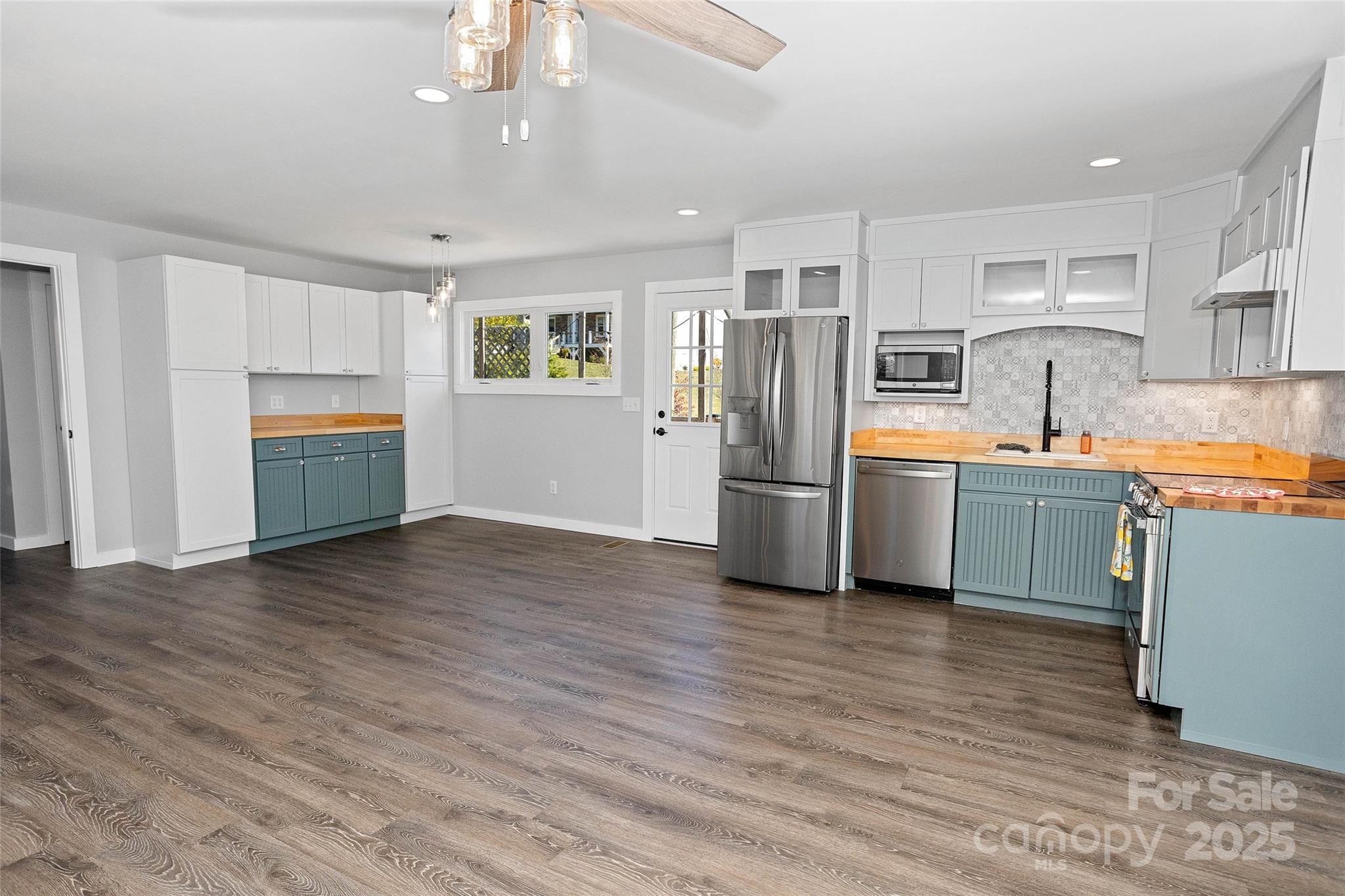 3471 Chimney Rock Road Hendersonville, NC 28792 - Photo 37 of 48 a kitchen with stainless steel appliances a refrigerator and a sink