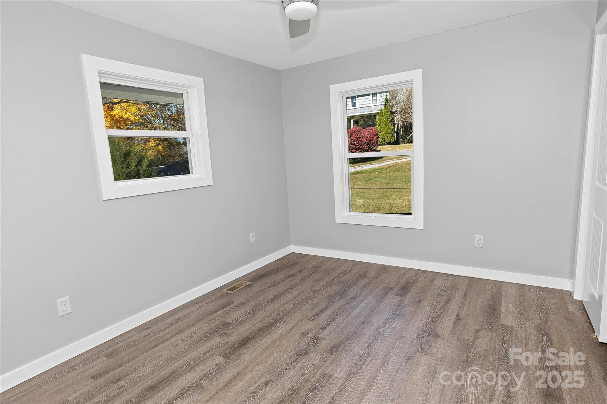 3471 Chimney Rock Road Hendersonville, NC 28792 - Photo 40 of 48 an empty room that has a window and a painting on the wall