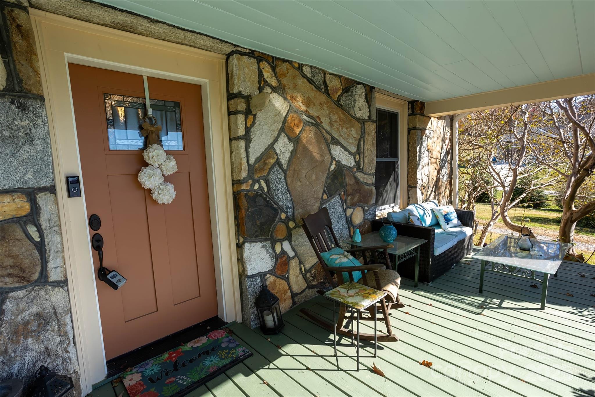 3471 Chimney Rock Road Hendersonville, NC 28792 - Photo 4 of 48 a living room with furniture and a fireplace